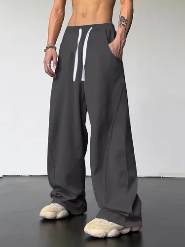 Vista 2 de OYOANGLE Pantalones deportivos holgados con cordón y cintura elástica Y2K para hombre, pantalones largos sueltos de pierna ancha con bolsillo
