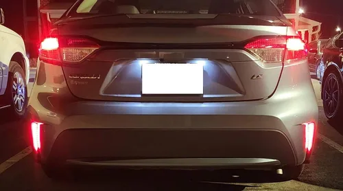 Vista 3 de iJDMTOY Luces reflectoras de parachoques LED de lente roja compatibles con Toyota Corolla Sedán 2019-22, funciona como faros antiniebla traseros