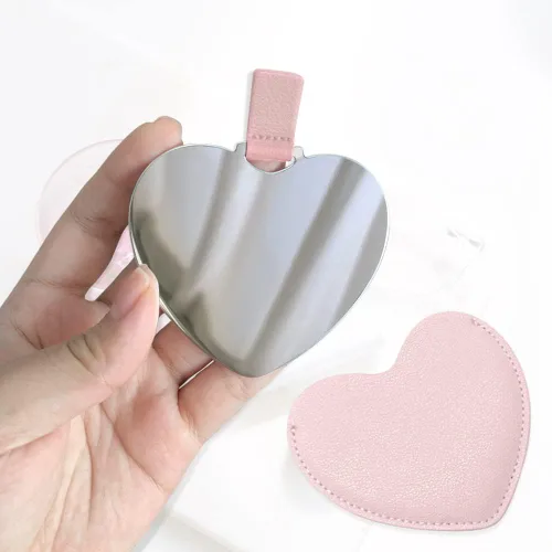 Vista 5 de Espejo compacto de acero inoxidable, espejo de bolsillo inastillable en forma de corazón con funda de piel sintética, mini espejo irrompible