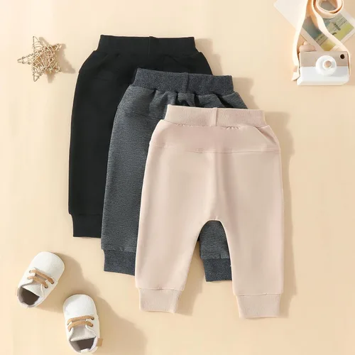 Vista 3 de Paquete de 3 pantalones deportivos básicos lisos y suaves de algodón de color liso, pantalones de algodón para otoño e invierno