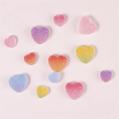 Vista 2 de DIYOMR 60 cuentas de caramelo de resina de caramelo con parte trasera plana, adornos de uñas a granel, dijes en forma de corazón y estrella