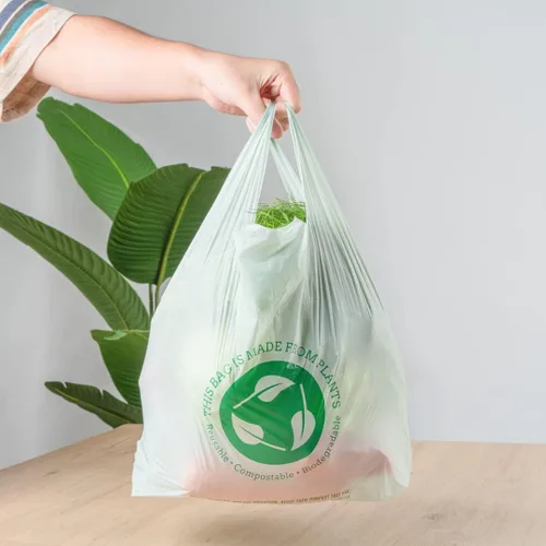 Vista 5 de Restaurantware -Bolsas de comestibles de tamaño 1/6, 100 bolsas de plástico duraderas - Asas de camiseta, bolsa de compras de plástico verde de alta
