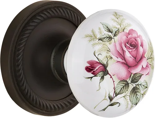 Vista 11 de Nostalgic Warehouse 711306, Mortaja de 2.25 pulgadas, roseta de cuerda de latón antiguo con perilla de porcelana rosa blanca