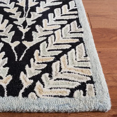 Vista 4 de SAFAVIEH Capri Collection - Alfombra de área de 9 x 12 pies, color negro y marfil, lana hecha a mano, ideal para zonas de alto tráfico en sala