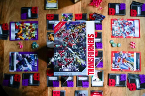 Vista 5 de Renegade Game Studios Transformers Deck Building Juego Choque de la Expansion for 1-5 Players Featuring 6 Giant-Sized Cards and 75 New Strategy