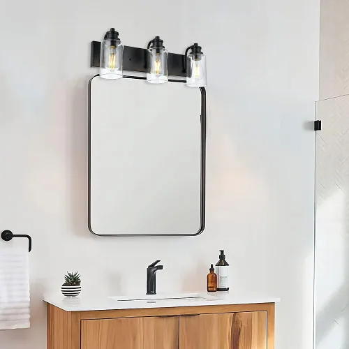 Vista 5 de Lámpara de baño vintage de 3 cabezales en acabado negro mate, pantalla de vidrio transparente clásica, iluminación de baño sobre espejo, lámpara