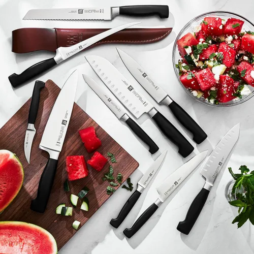 Vista 3 de ZWILLING Four Star - Cuchillo Santoku de borde hueco de 7 pulgadas, color negro y acero inoxidable