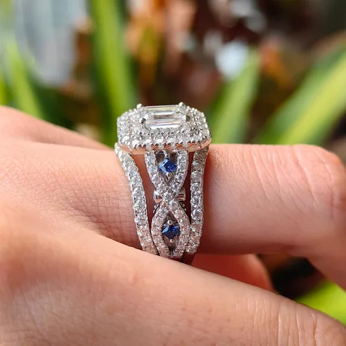 Vista 4 de DovEggs 3.26ct Total 5x7mm G-H-I Color Emerald Cut Moissanite Antqiue Double Halo Engagement Ring Moissanite&Blue Sapphire Accents Curved Enhancer