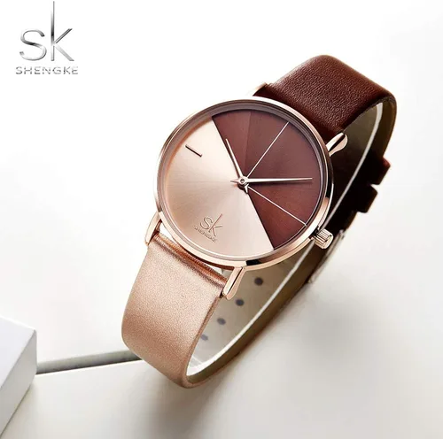 Vista 2 de SHENGKE Simplicity Creative - Reloj de pulsera para mujer, de cuero auténtico, elegante, para mujer, Movimiento de cuarzo