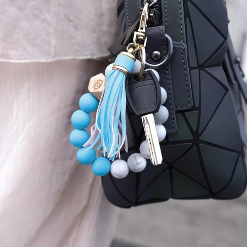 Vista 5 de Llavero de silicona para mujer con cuentas de llavero de pulsera portátil de borla de coche
