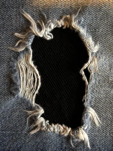 Vista 2 de Parches de mezclilla elástica negra súper resistente para planchar - de Holey Patches (tamaños surtidos) (1-5" x 8")