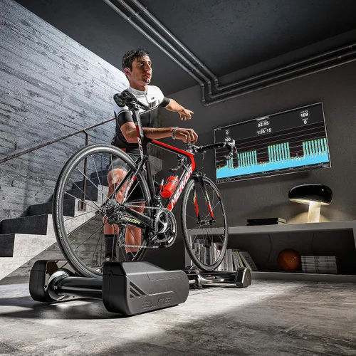 Vista 8 de Elite Nero Interactive Roller - Entrenador inteligente para bicicleta con doble volante, simulación de gradiente del 7%, conectividad ANT+