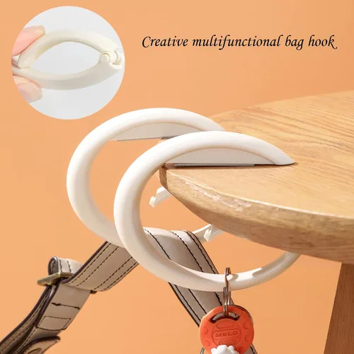 Vista 4 de Percha portátil para bolsos, gancho plegable portátil para mesa, soporte antideslizante sin perforaciones, colgador de mesa para oficina, lugares