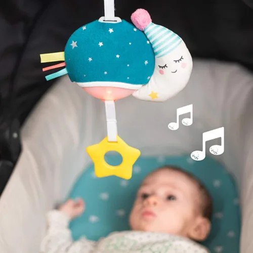 Vista 4 de Taf Toys Mini luna musical, juguete para bebés con música colgante y luces para llevar, compañero de viaje para padres y bebés, calma al bebé