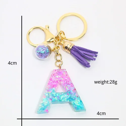 Vista 2 de Fuqimanman2020 Llavero de letra A-Z con purpurina de resina rosa y azul, alfabeto inicial, accesorios con bola de cristal de borla morada