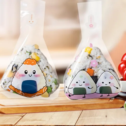 Vista 8 de iplusmile 100 bolsas de embalaje de bolas de arroz desechables con patrones creativos para loncheras y restaurantes de sushi, 7.48 x 5.90 pulgadas