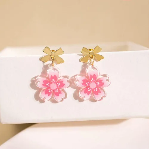 Vista 4 de Aretes colgantes ligeros con nudo de lazo rosa con flor de Sakura para mujeres, adolescentes y niñas, delicados aretes de mariposa chapados en oro