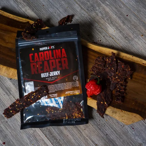 Vista 3 de Pepper Joe's Carolina Reaper Beef Jerky – Cecina de res picante peligrosamente deliciosa con pimienta más picante del mundo y cortes de pechuga