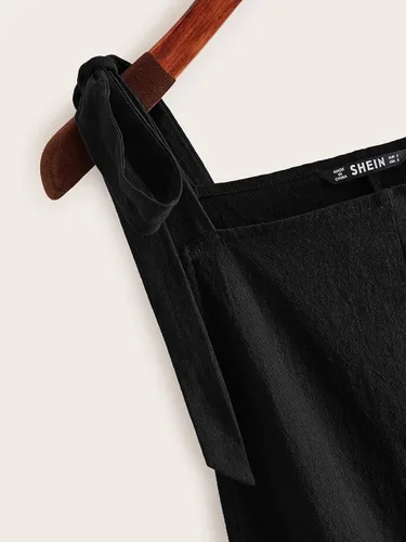Vista 3 de WDIRARA Mameluco sin mangas con tirantes para mujer, pantalones cortos con bolsillos