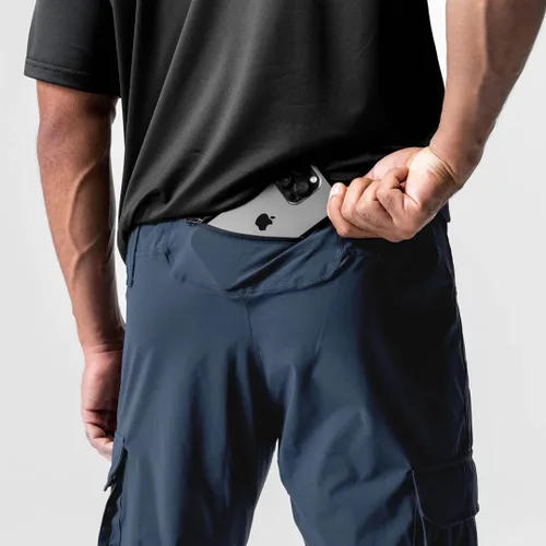 Vista 5 de Pantalones de entrenamiento ligeros para hombre con bolsillos con cremallera
