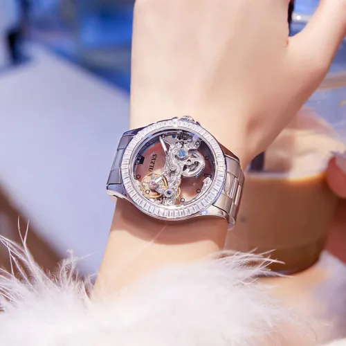 Vista 3 de OLEVS Reloj de mujer con diseño de esqueleto, mecánico automático, plateado, de lujo, impermeable, luminoso, para regalo del día de San Valentín