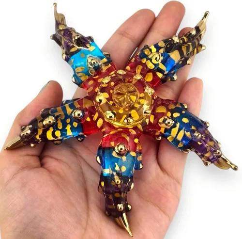 Vista 4 de Pequeña figura de estrella de mar multicolor de 2 pulgadas de largo, miniatura soplada a mano, pez estrella de cristal, multicolor, colorido, mar