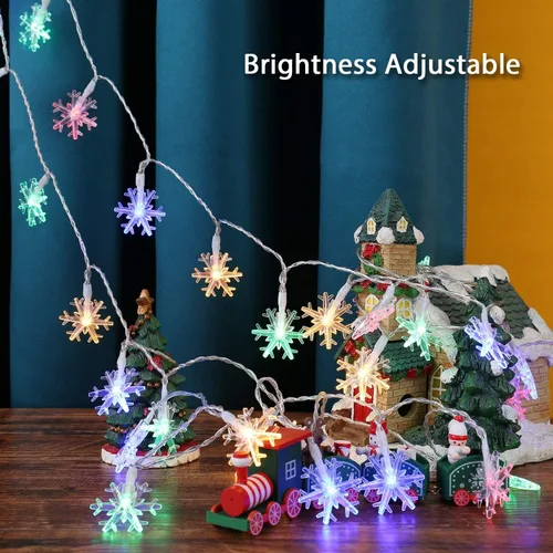Vista 2 de BrizLabs - Luces de copo de nieve de colores, 40 LED 16.08 pies de luces de Navidad en forma de copo de nieve con control remoto, 8 modos de luces