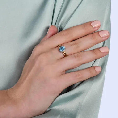 Vista 5 de Jewelili Enchanted Disney Fine Jewelry - Anillo de plata de ley y oro amarillo de 10 quilates, 0.276 x 0.197 in, topacio azul suizo ovalado y 110