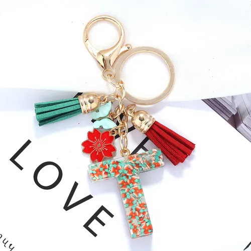 Vista 2 de Llavero de letras iniciales del alfabeto de flores de moda, doble borla, colgante de flor, llavero para bolso, bolsos de mano para mujeres y niñas