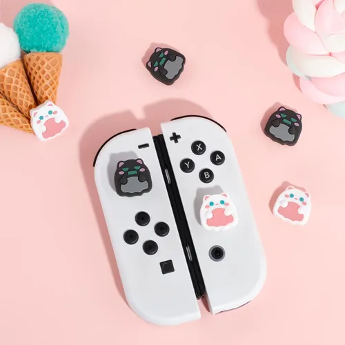 Vista 3 de FunMax - 4 tapas de silicona con agarre para el pulgar en 3D, para Nintendo SwitchOLEDSwitch Lite (gato fantasma)
