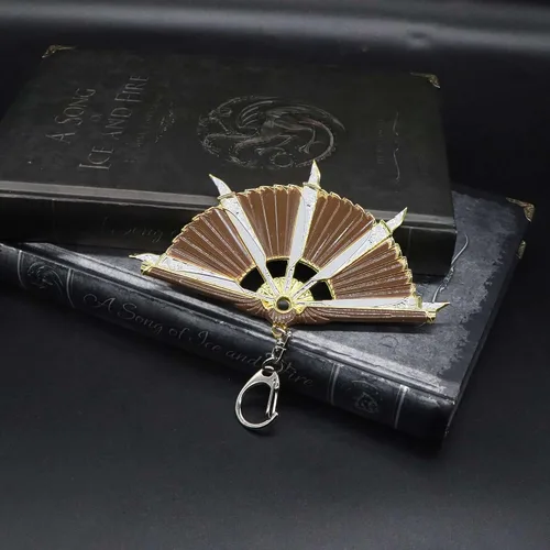 Vista 2 de crafthand Llavero de metal Loba Heirloom Mini Fan Metal Colgante Figura Decoración de Escritorio Mochila Colgante Suministros de Fiesta Regalo, Oro