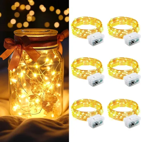 Vista 52 de AIKEI Paquete de 12 luces LED de hadas que funcionan con pilas, guirnaldas de luces impermeables de 7 pies, 20 luces LED de luciérnagas estrelladas