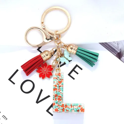 Vista 2 de Llavero de letras iniciales del alfabeto de flores de moda, doble borla, colgante de flor, llavero para bolso, bolsos de mano para mujeres y niñas