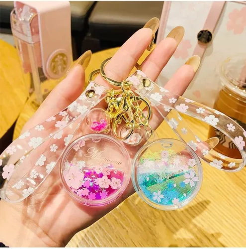 Vista 2 de Sunfans Llavero para niñas y mujeres, con diseño de flor de cerezo y flores de ensueño, diseño de arena en movimiento
