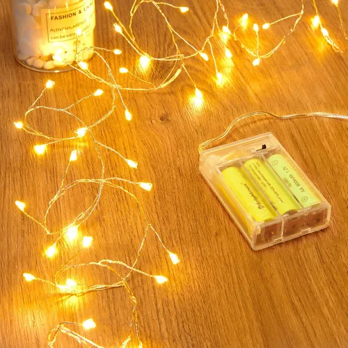 Vista 12 de Luces de hadas que funcionan con pilas, luces de cuerda centelleantes impermeables con cable plateado de 5 pies y 60 LED, luces de fuegos