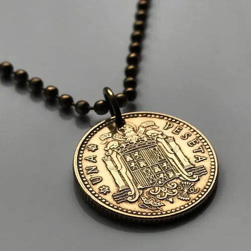 Vista 2 de 1975 España España 1 Peseta moneda colgante escudo Español Madrid Barcelona Sevilla Toledo Málaga Granada Cádiz Córdoba Valencia Bilbao Coruña