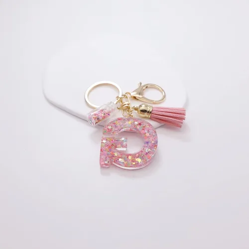 Vista 3 de Mlouye Llaveros coloridos con letras de estrella para mujeres y niñas, lindas resinas de la A a la Z, letras del alfabeto con borla para llaves