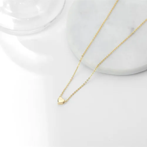 Vista 6 de Delicado collar con pequeño dije de corazón de oro, (además hay modelos con dije de corazón con inicial, con dije de rosa y con circonia cúbica)
