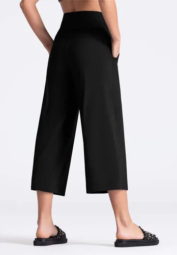 Vista 4 de THE GYM PEOPLE Bootleg - Pantalones capri de yoga para mujer, control de abdomen, cintura alta, pantalones cortos acampanados con bolsillos