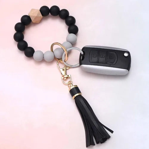 Vista 3 de BAOSIWA Pulsera de cuentas de silicona con llavero de pulsera para mujer con borla de cuero