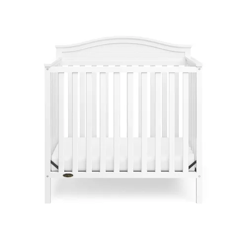 Vista 4 de Graco Stella: Cuna convertible mini 4 en 1 con colchón adicional (blanco) – Incluye colchón adicional de 2.75 pulgadas de grosor con cubierta
