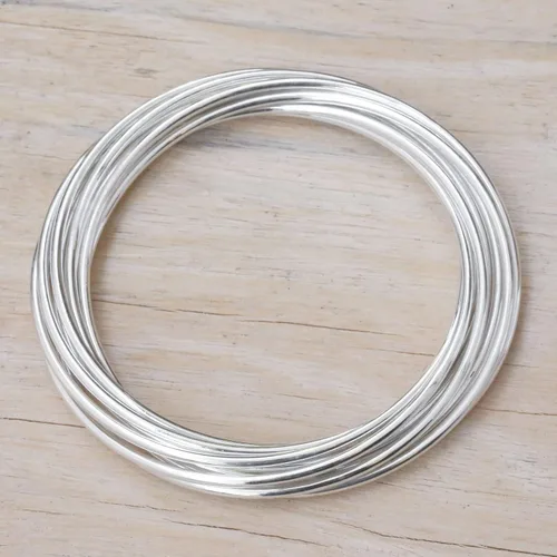 Vista 4 de NOVICA Juego de 10 pulseras de plata de ley 925 hechas a mano para mujer, pulseras de plata de moda para mujer, Unión Fortificada, Sin gemas.