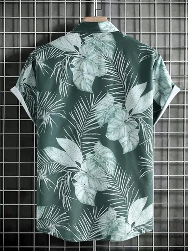 Vista 2 de OYOANGLE Camisa hawaiana de manga corta con botones y estampado tropical para hombre