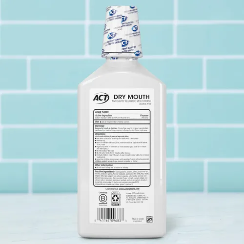 Vista 2 de ACT Enjuague bucal anticaries cero alcohol con fluoruro para boca seca, menta calmante, 33.8 fl. oz.