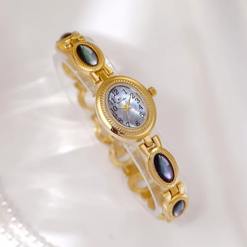 Vista 3 de CARLIEN Reloj de pulsera de cuarzo ovalado para mujer, de lujo, delicado, dorado, plateado, perla y números arábigos, fácil de leer, resistente al