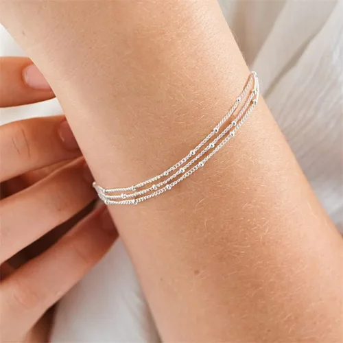 Vista 2 de Pulsera de cadena de elegante oro para mujer, pulseras de cadena individual o en capas, con eslabón de dije de corazón, karma, triángulo, perlas
