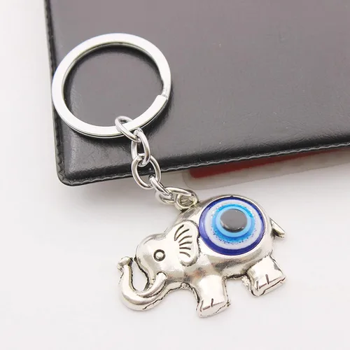Vista 2 de Llavero de elefante lindo para mujer, colgante de aleación de diamantes de imitación de cristal, llavero de ojo azul para bolsa de llaves, teléfono