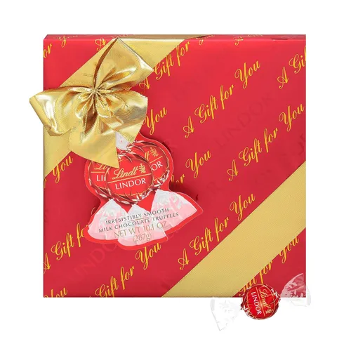 Vista 21 de Lindt LINDOR Caja de Regalo Tradiciones de Trufas de Chocolate con Leche, Caramelo de Chocolate con Leche con Centro de Trufa Suave y Derretido, 6.8