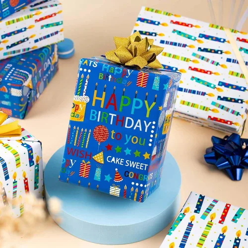 Vista 2 de Homeral Rollo de papel de regalo azul para cumpleaños - 17 pulgadas x 16.5 pies, con letras reversibles de "Feliz Cumpleaños" y velas coloridas.
