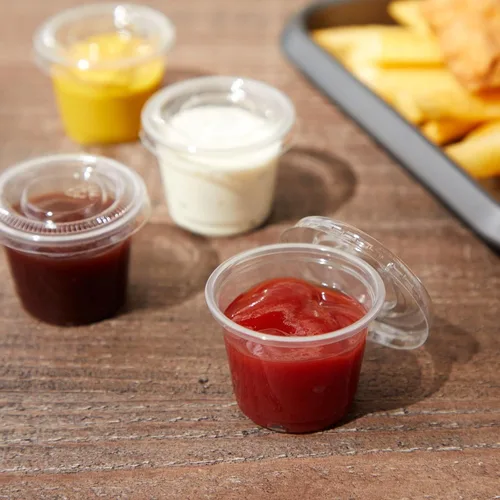 Vista 2 de Juvale Vasos desechables con tapas, plástico de 1 onza, transparente, paquete de 500 unidades, tazas de condimentos, recipientes de salsa